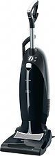 A black vacuum cleaner is sitting on top of a white surface.