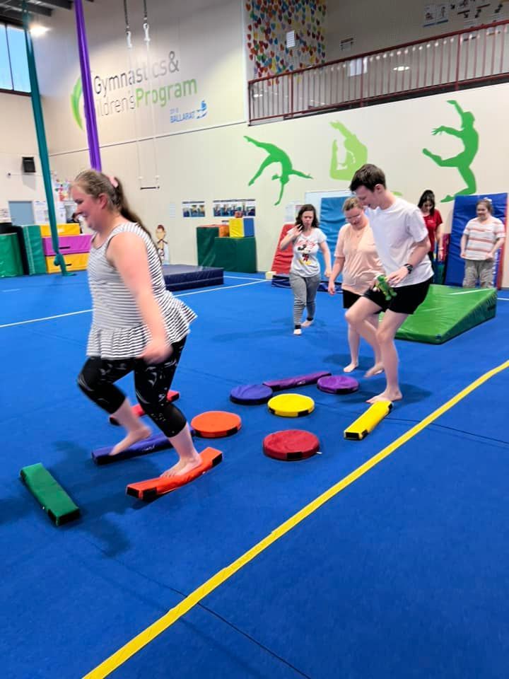 A Group of Young People Playing with Frisbees in a Gym | Ballarat, Vic | West End Support Services