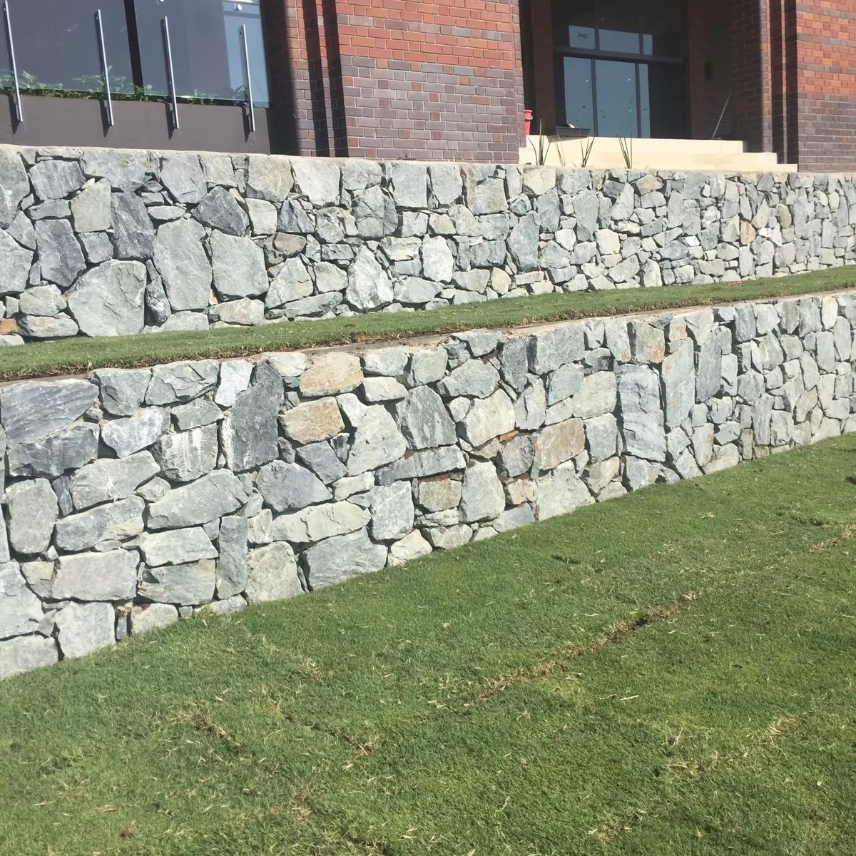 Stone pitched retaining walls