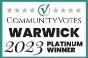 A sign that says community votes warwick 2023 platinum winner.