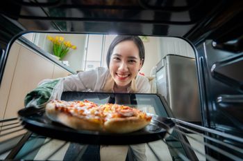 Happy woman baking - New Smyrna Beach, FL | Stewart's Appliance Repair Happy woman baking - New Smyrna Beach, FL | Stewart's Appliance Repair
