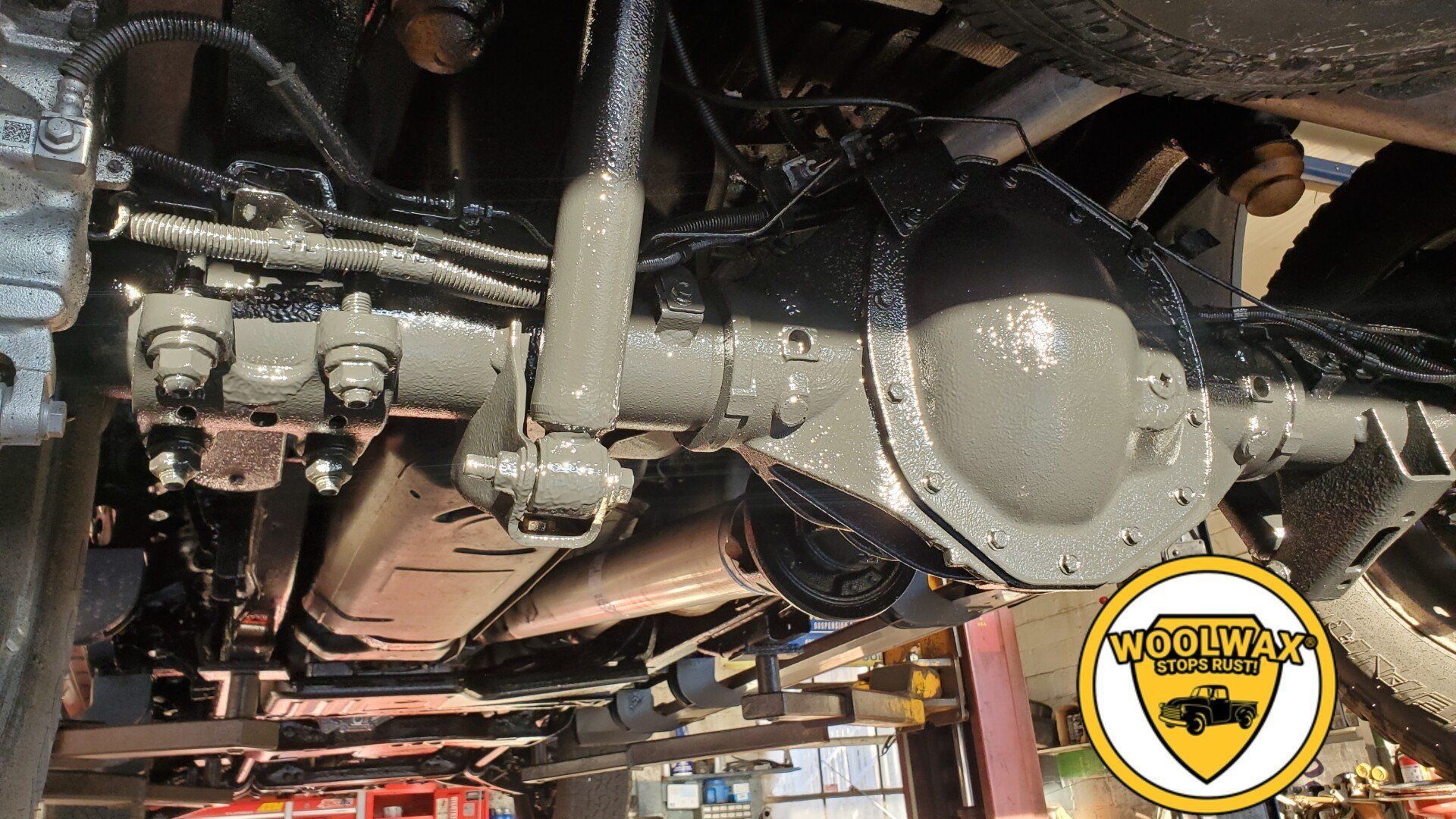 a close up of the underside of a vehicle with a yellow logo that says ' wrangler ' on it