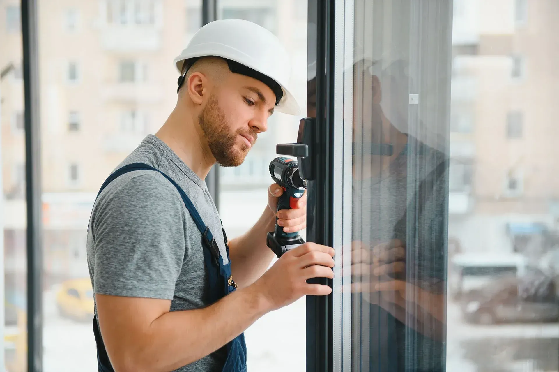 man installing window