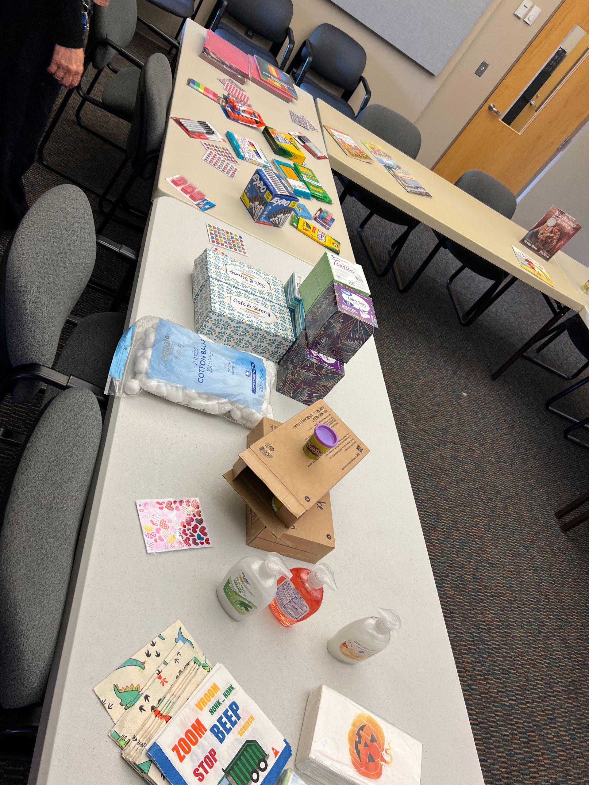 Table displaying numerous wrapped gifts, party favors, and decorations.