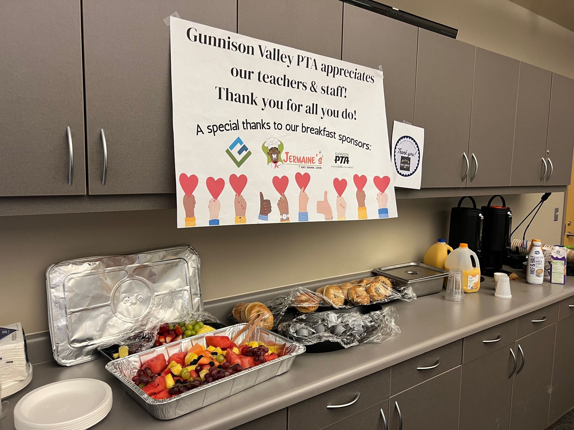 A teacher appreciation setup with food and a sign that reads,