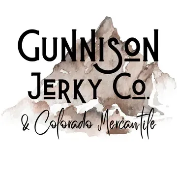 Logo for Gunnison Jerky Co. and Colorado Mercantile, featuring mountain watercolor behind bold black text.