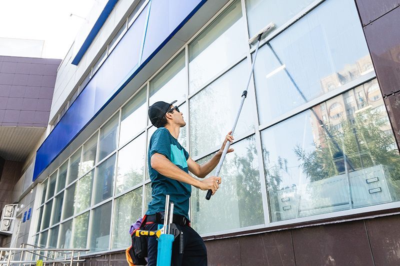 Person Cleaning The Windows