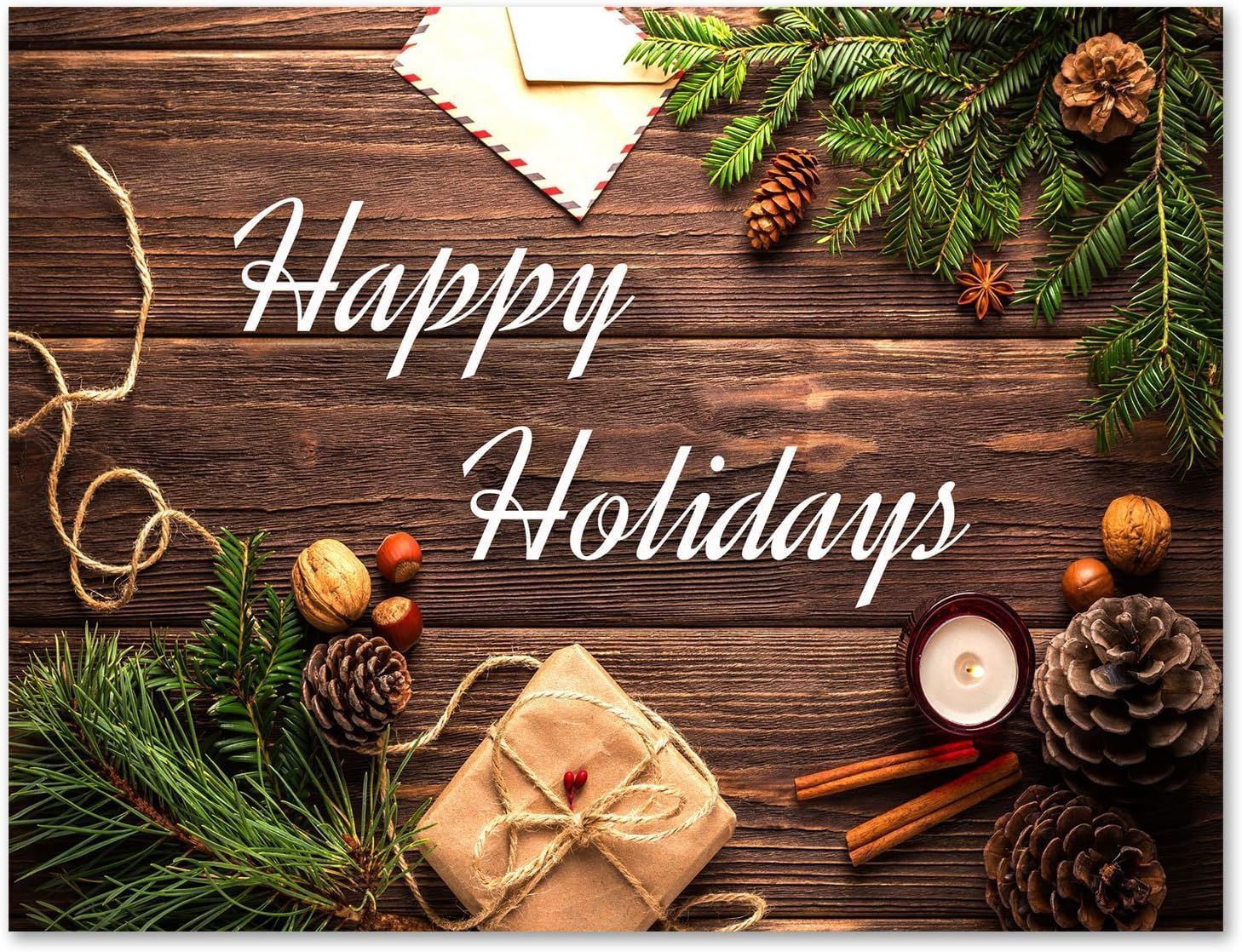 A wooden table topped with christmas decorations and the words `` happy holidays ''.