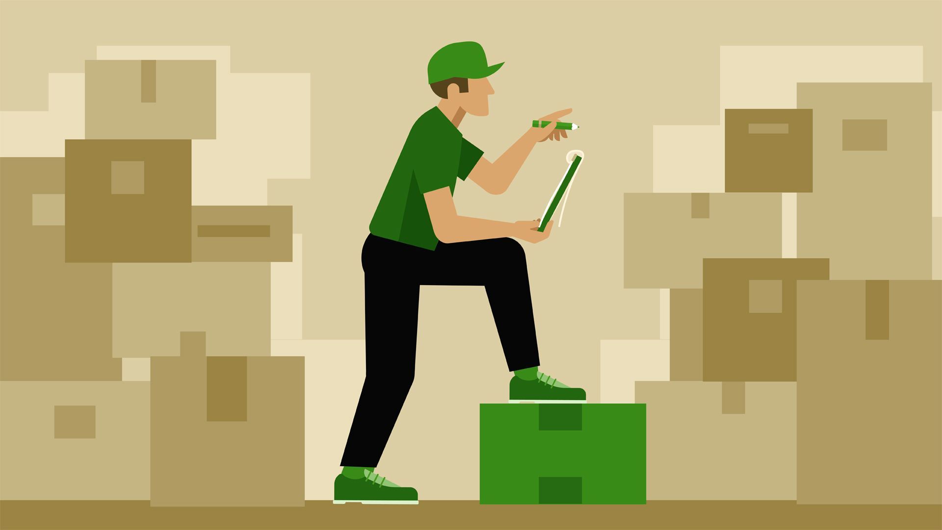 A delivery man is standing on a box while using a laptop computer.