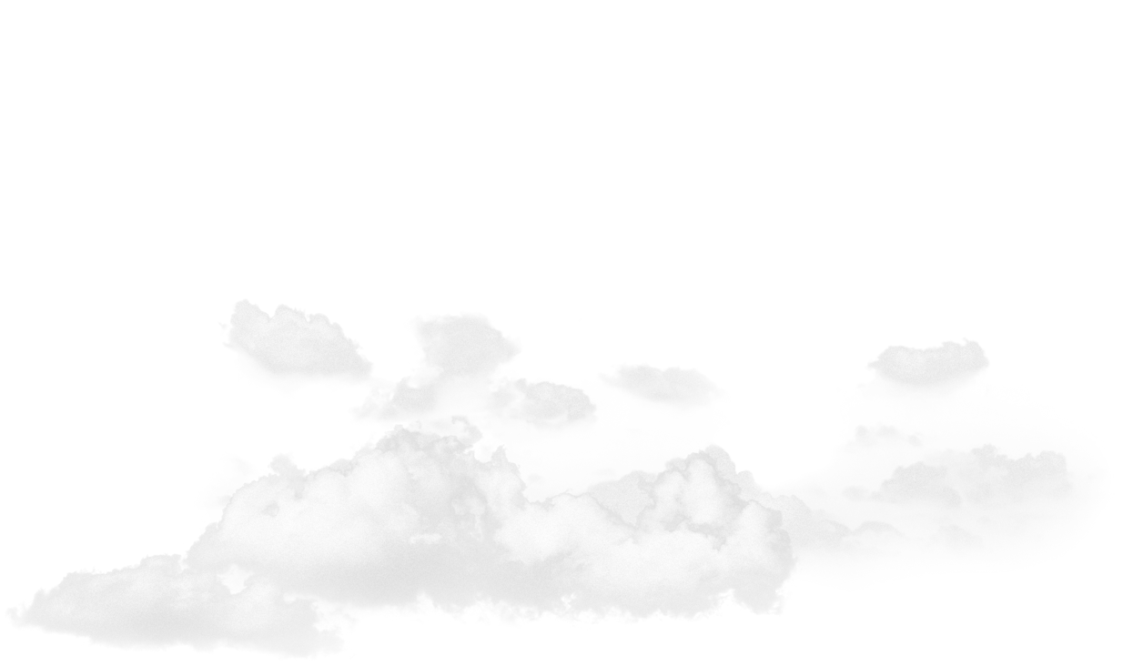 A pale, cloudy sky with soft white clouds drifting over a faint mountain silhouette.