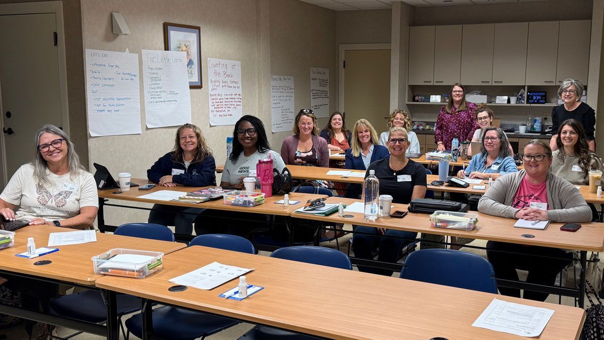 VIISA training participants pose for a group photo during a training session in the VIPS Louisville conference room.