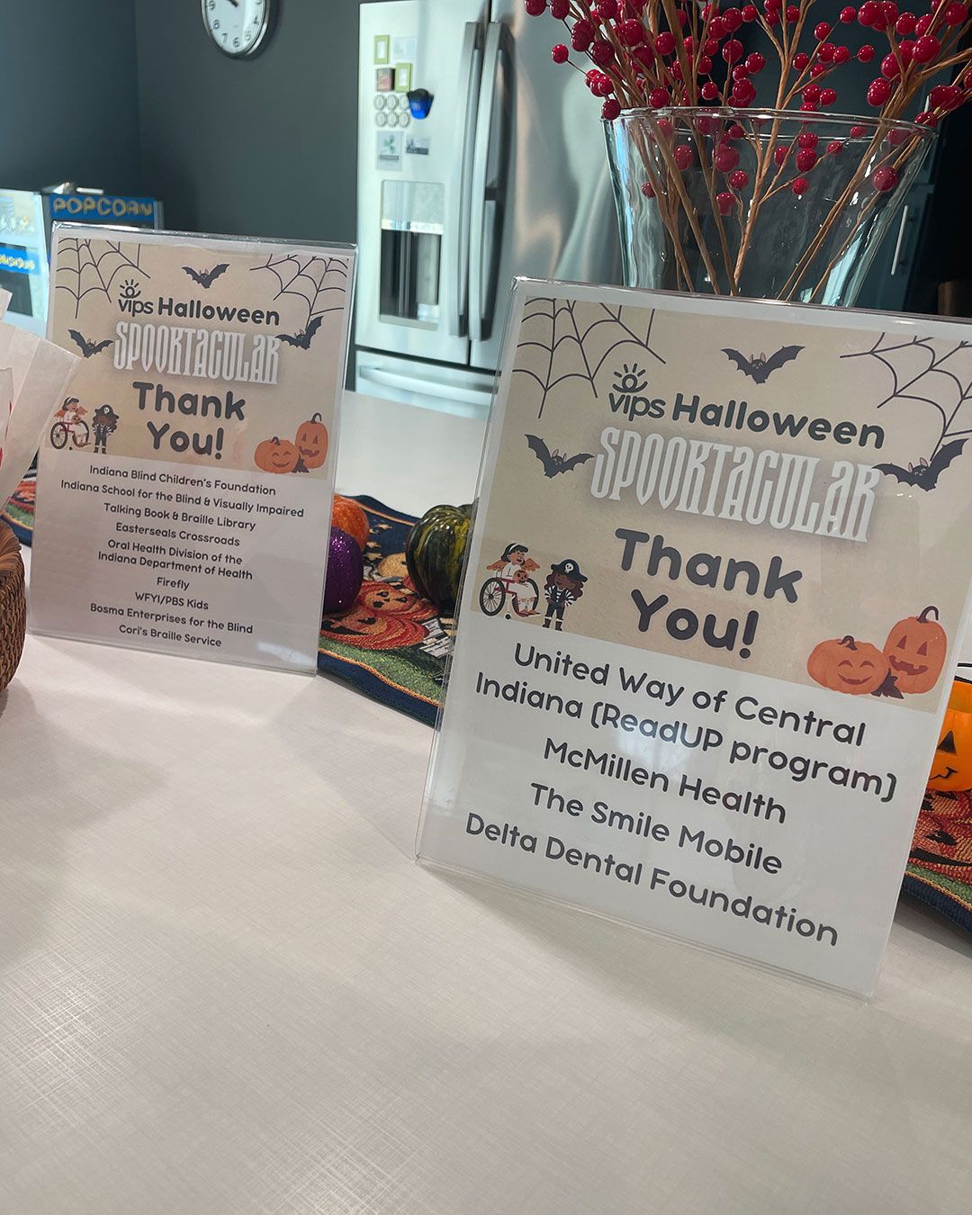 Signs thanking our sponsors and participating organizations sit alongside the refreshments on the kitchen island at the FRC.