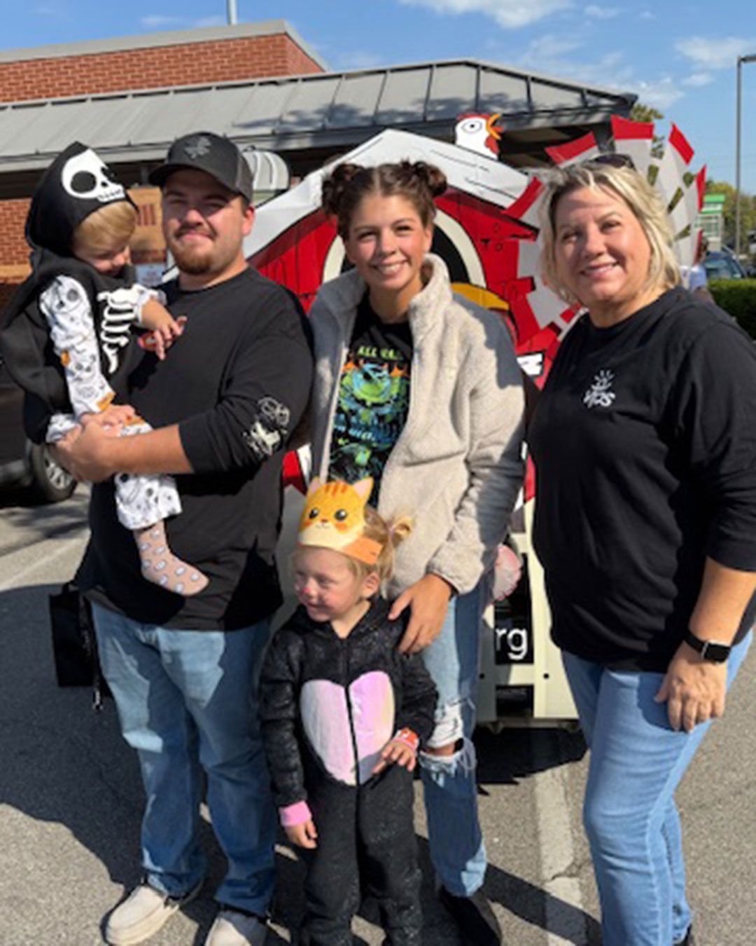 Tammy Maynard and a VIPS family of four pose for a photo.
