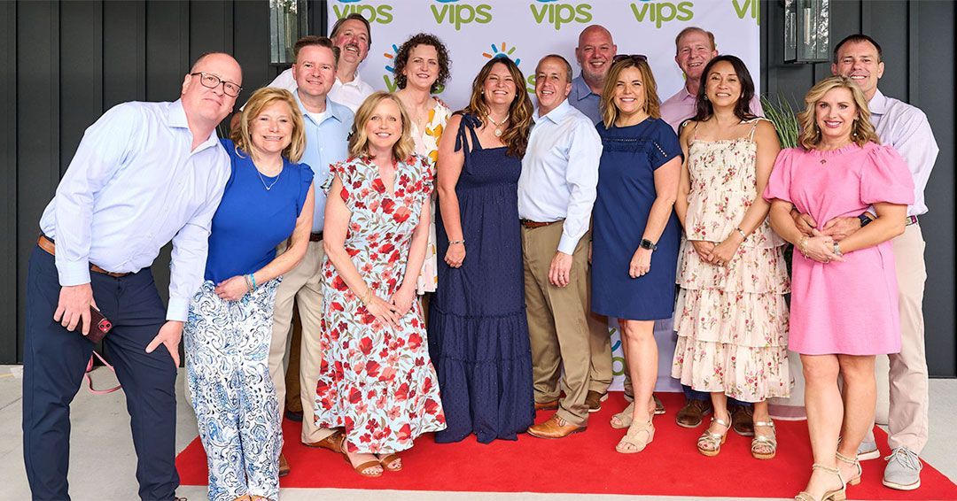 A group of nine pose for a photo during the 2025 VIPS Gala.