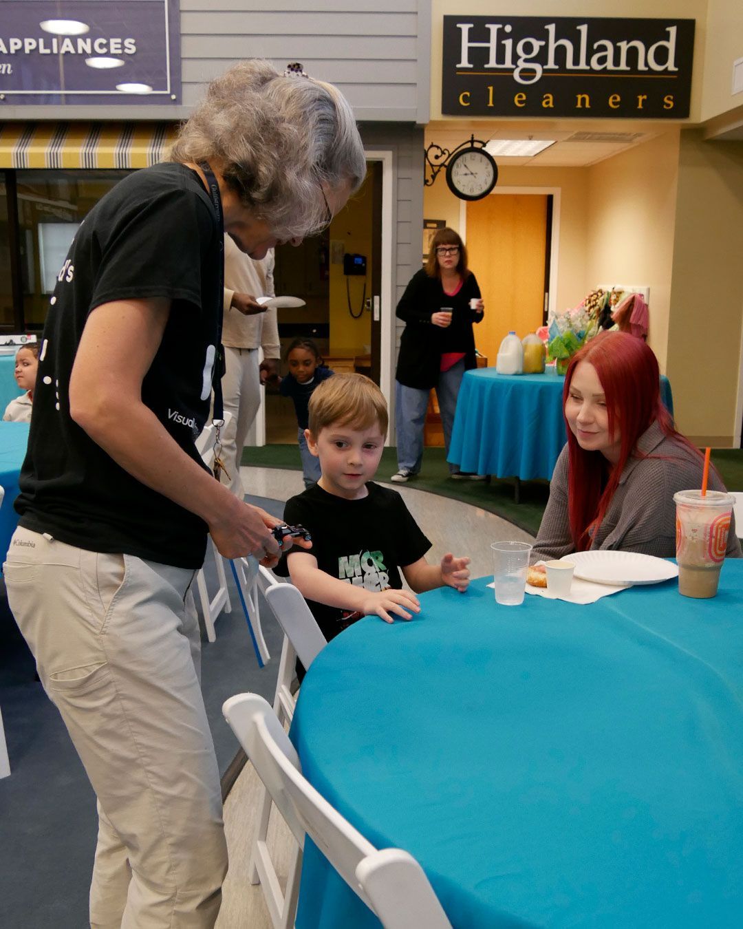 Rebekah talks to a student and his mother.
