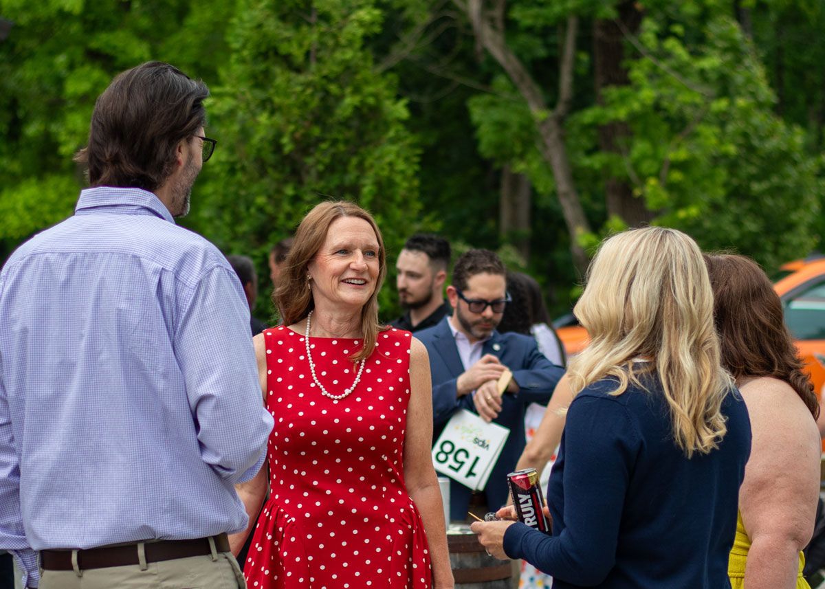 A group of Gala attendees chats at Progress Park before the program begins.