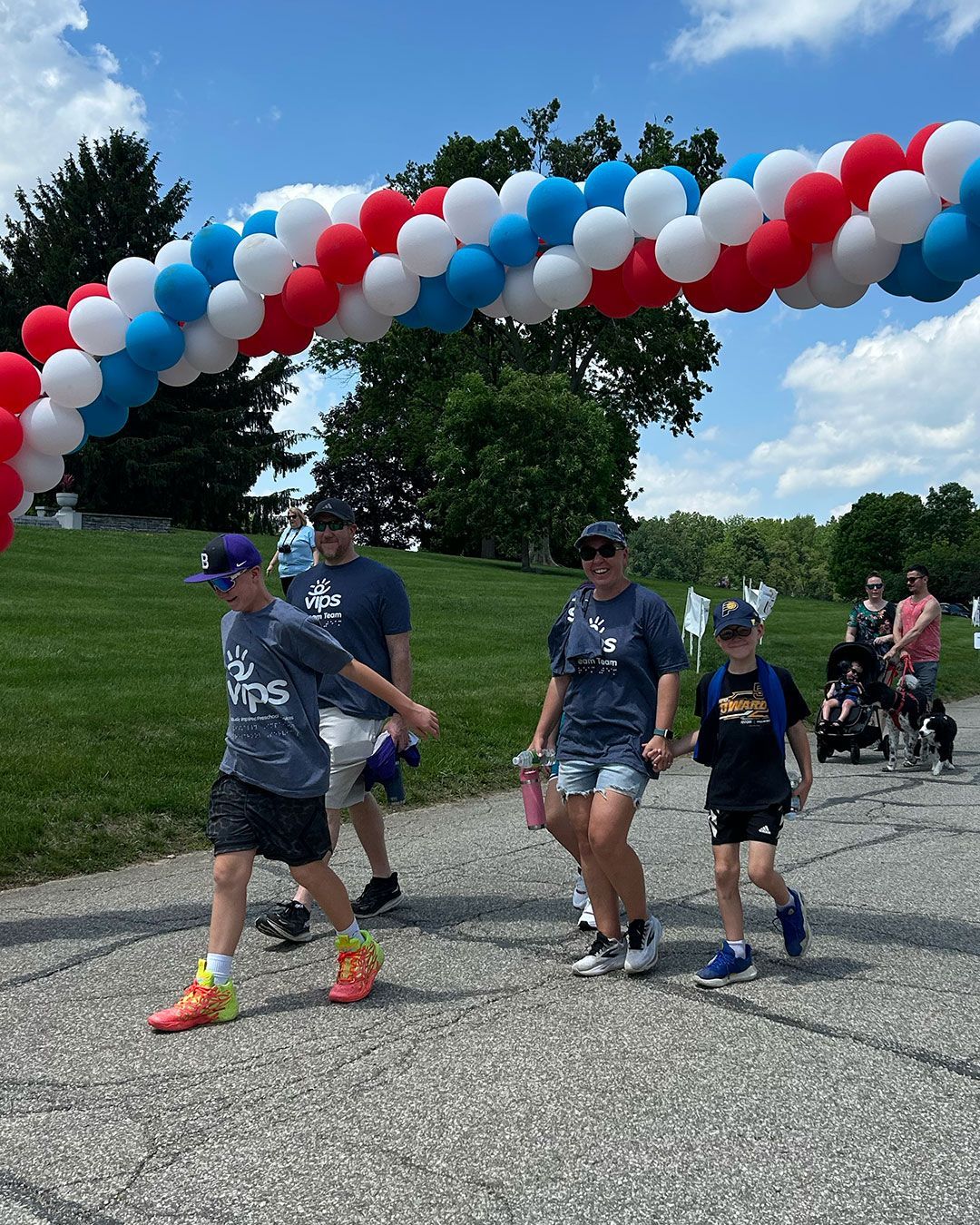 Walkers under the balloon arch at Walking for Dreams.