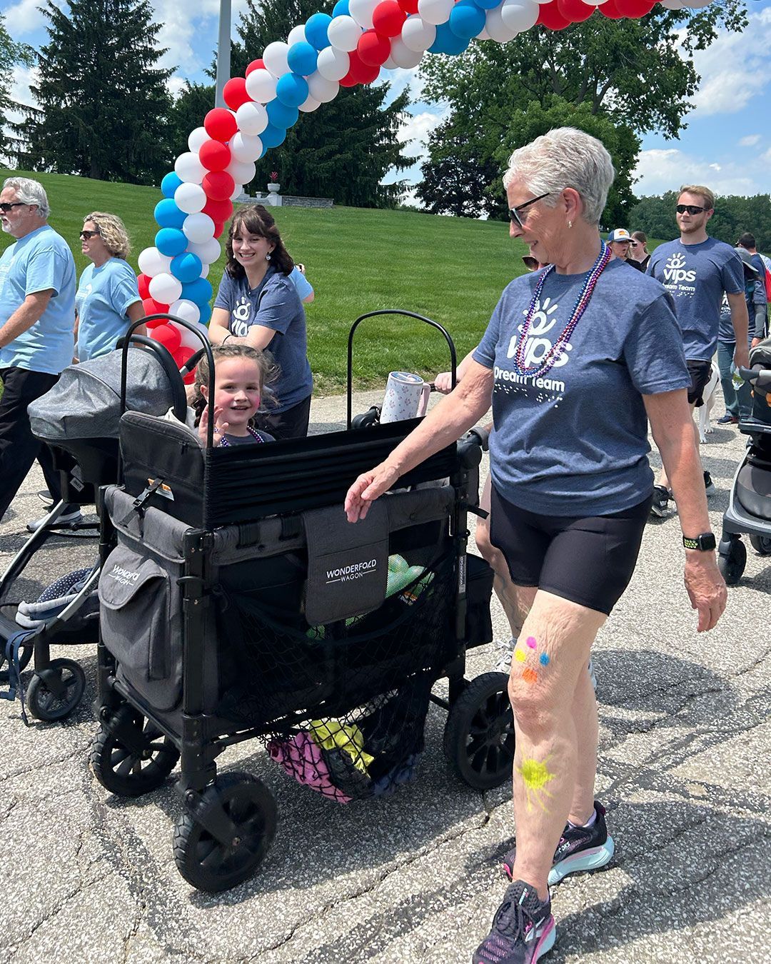 Walkers under the balloon arch at Walking for Dreams.