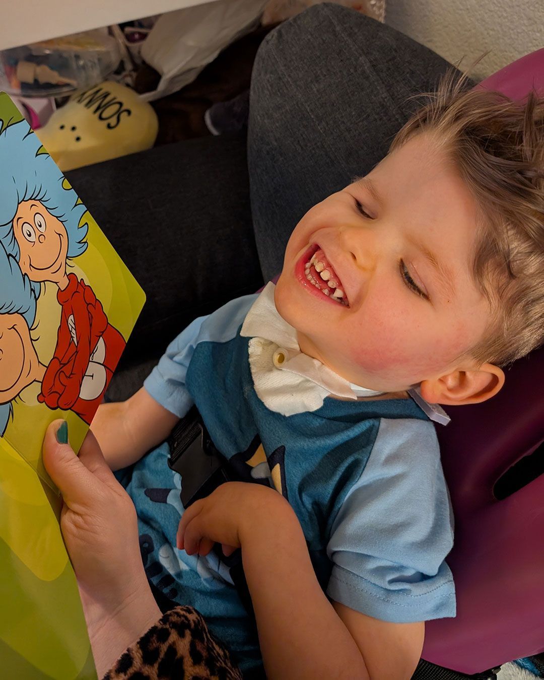 Sonny is reading Dr. Suess and laughing.
