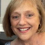 Woman smiling at the camera.