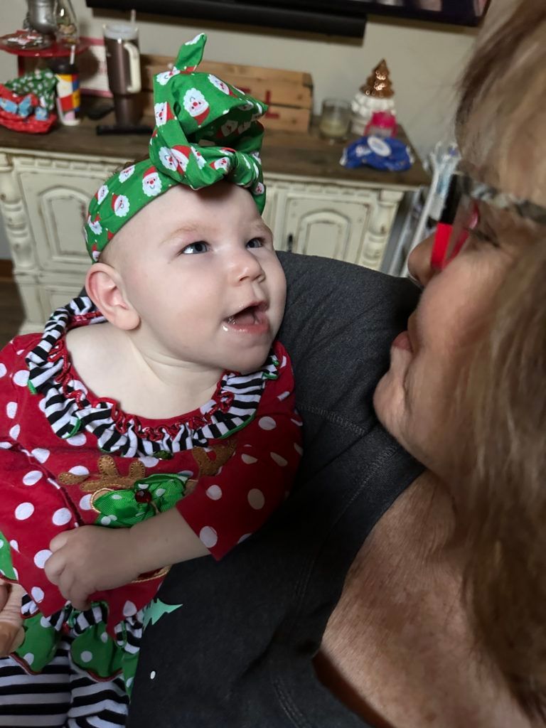 Brynn looking at the woman holding her