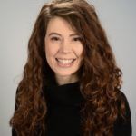 Woman smiling at the camera.