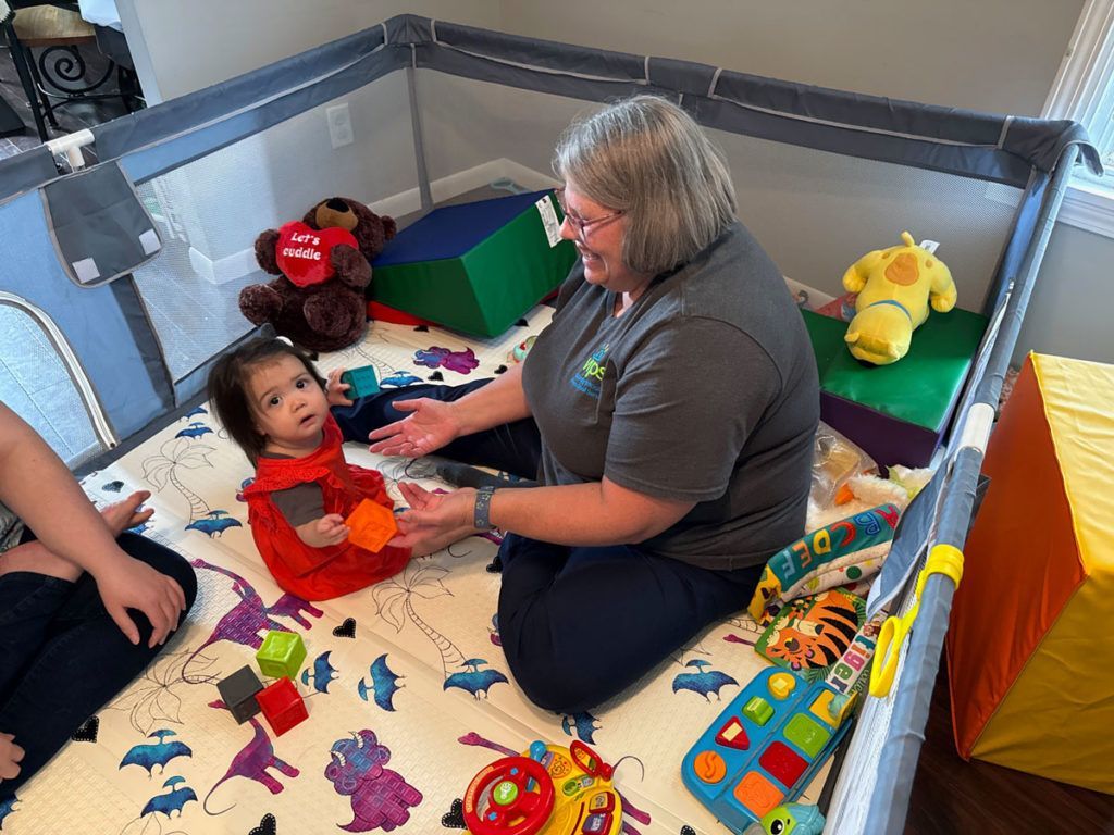 VIPS teacher working with toddler.