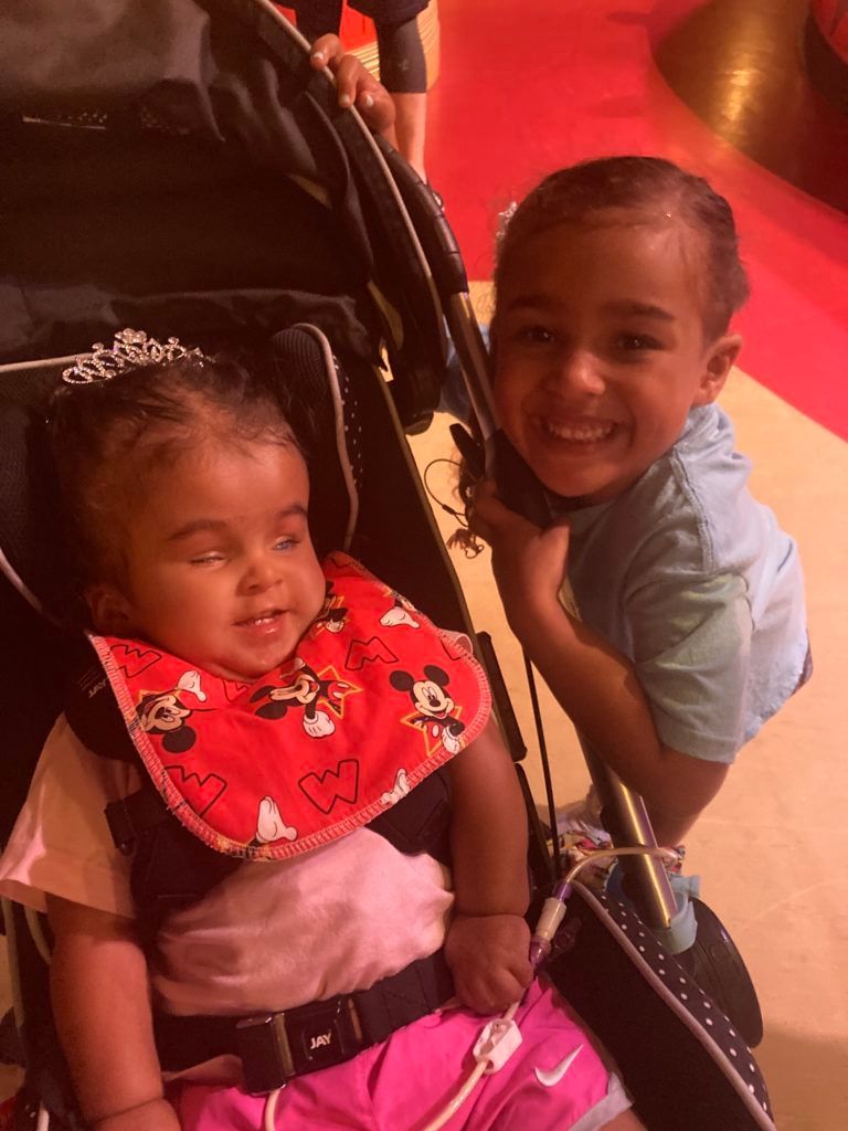 Tala and her sister KaiLayna smiling at the camera.