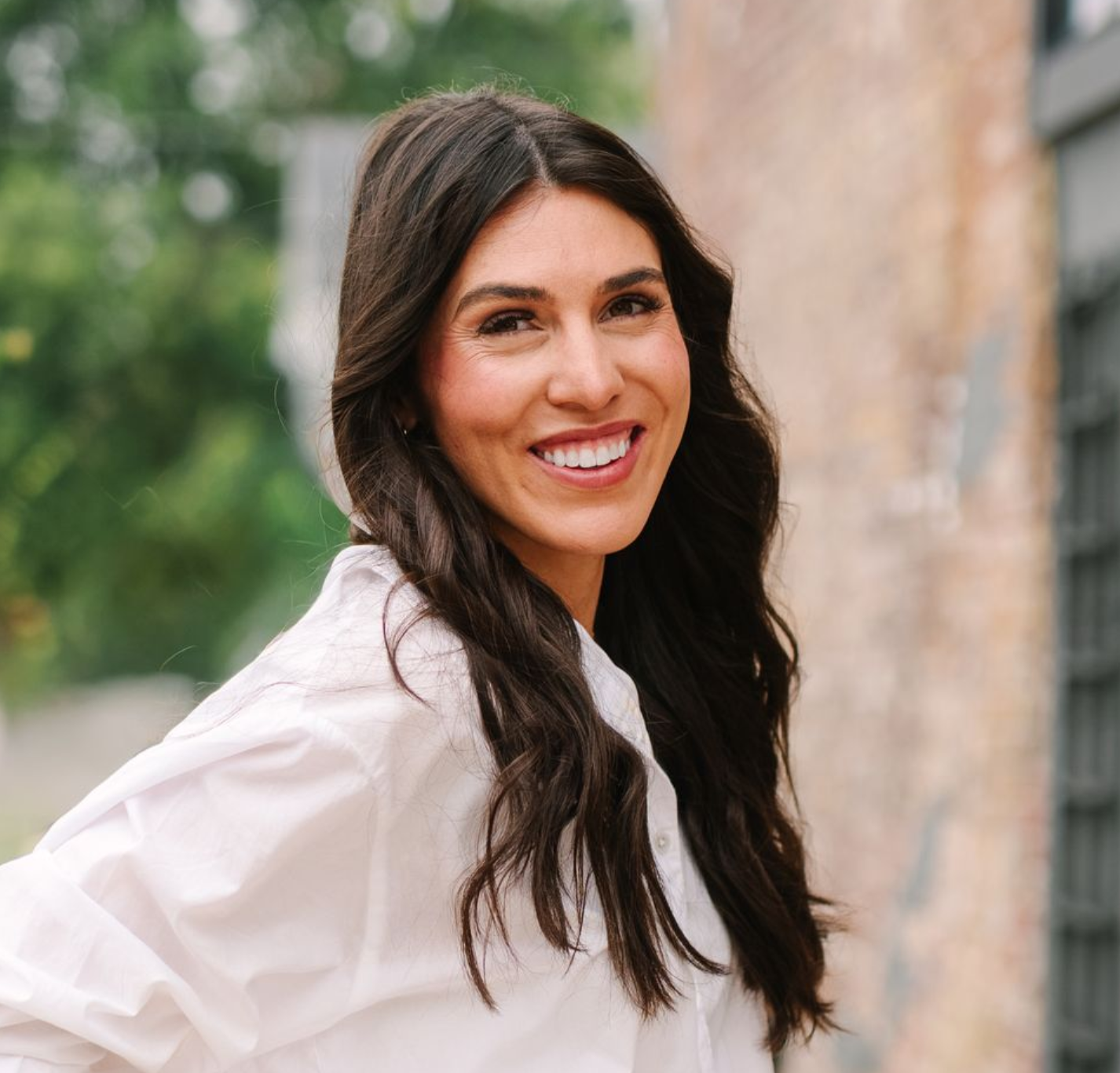 Woman smiling at the camera.