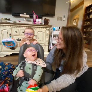Image of mother with visually impaired child looking directly at her face