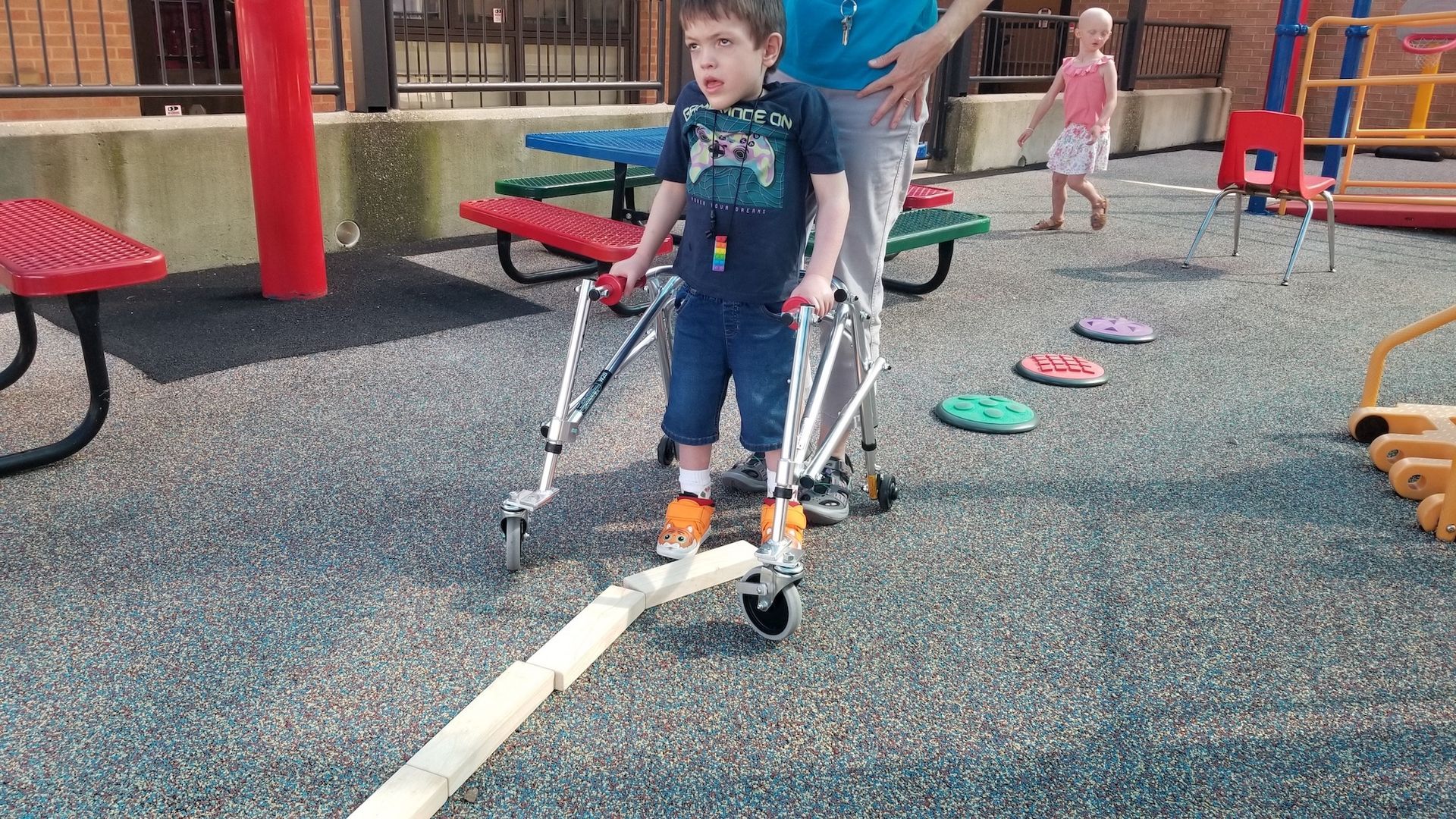Children outside doing an obstacle course