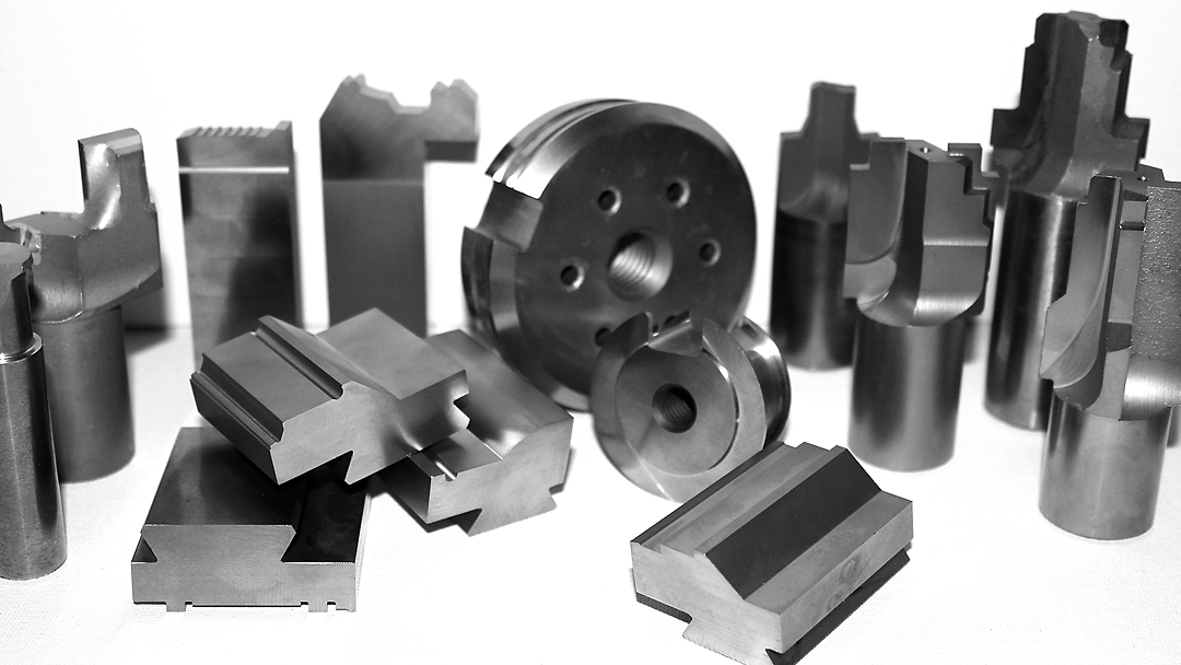 A bunch of metal pieces on a white surface