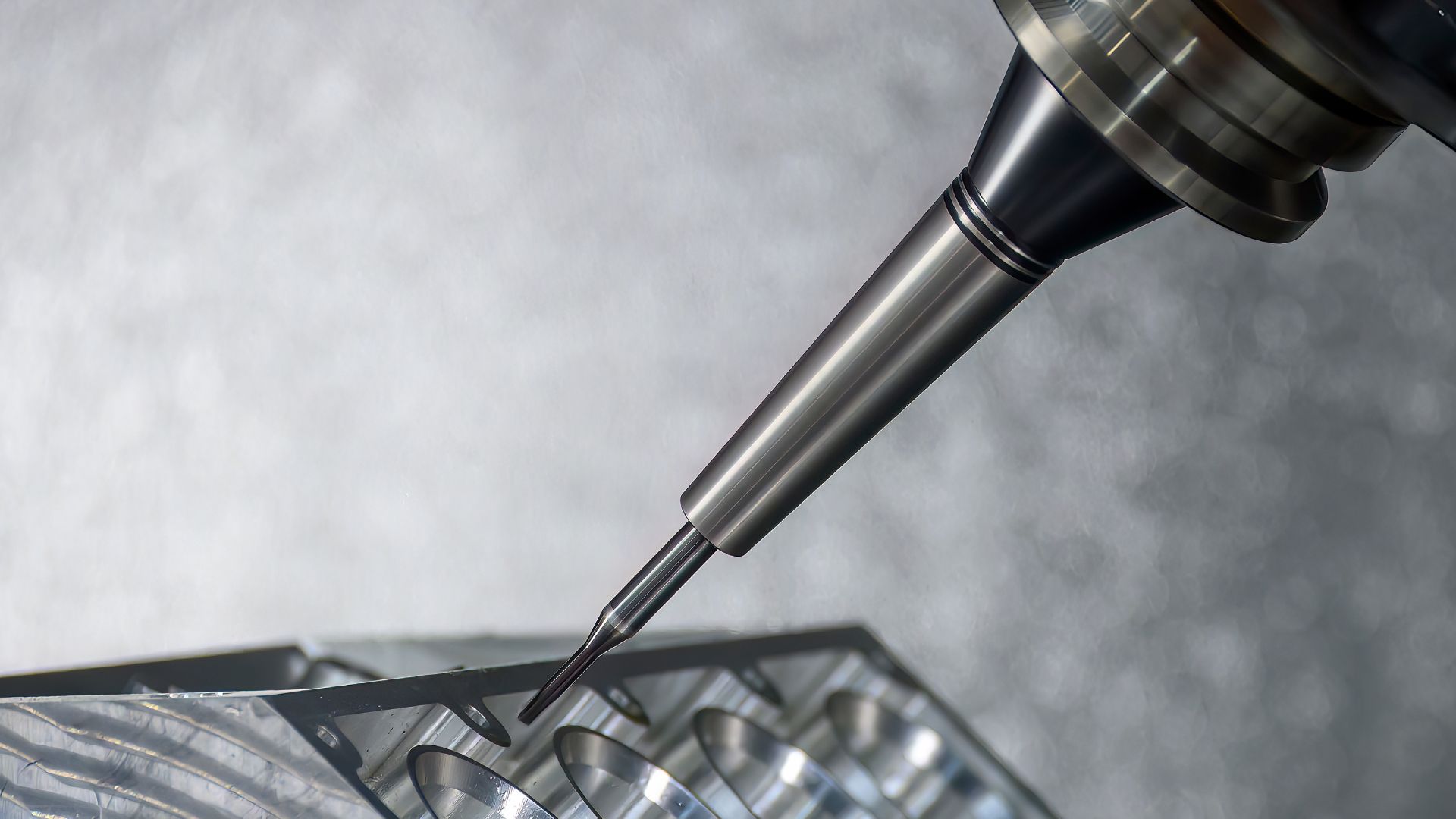 A close up of a machine cutting a piece of metal