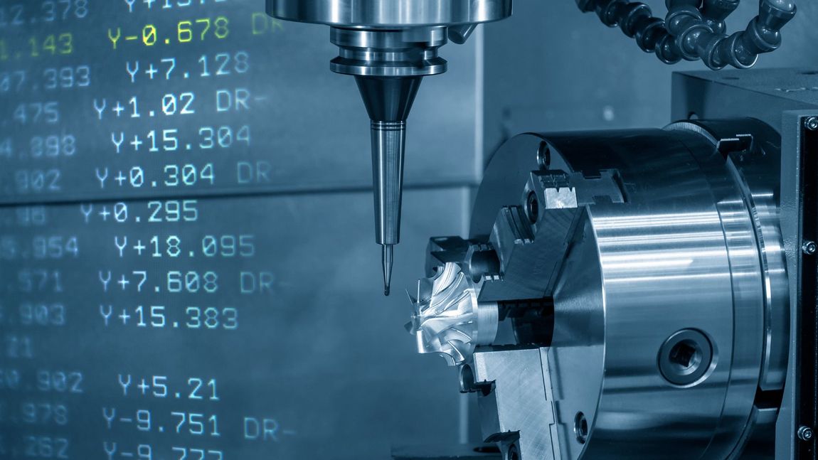 A machine is being used to cut a piece of metal