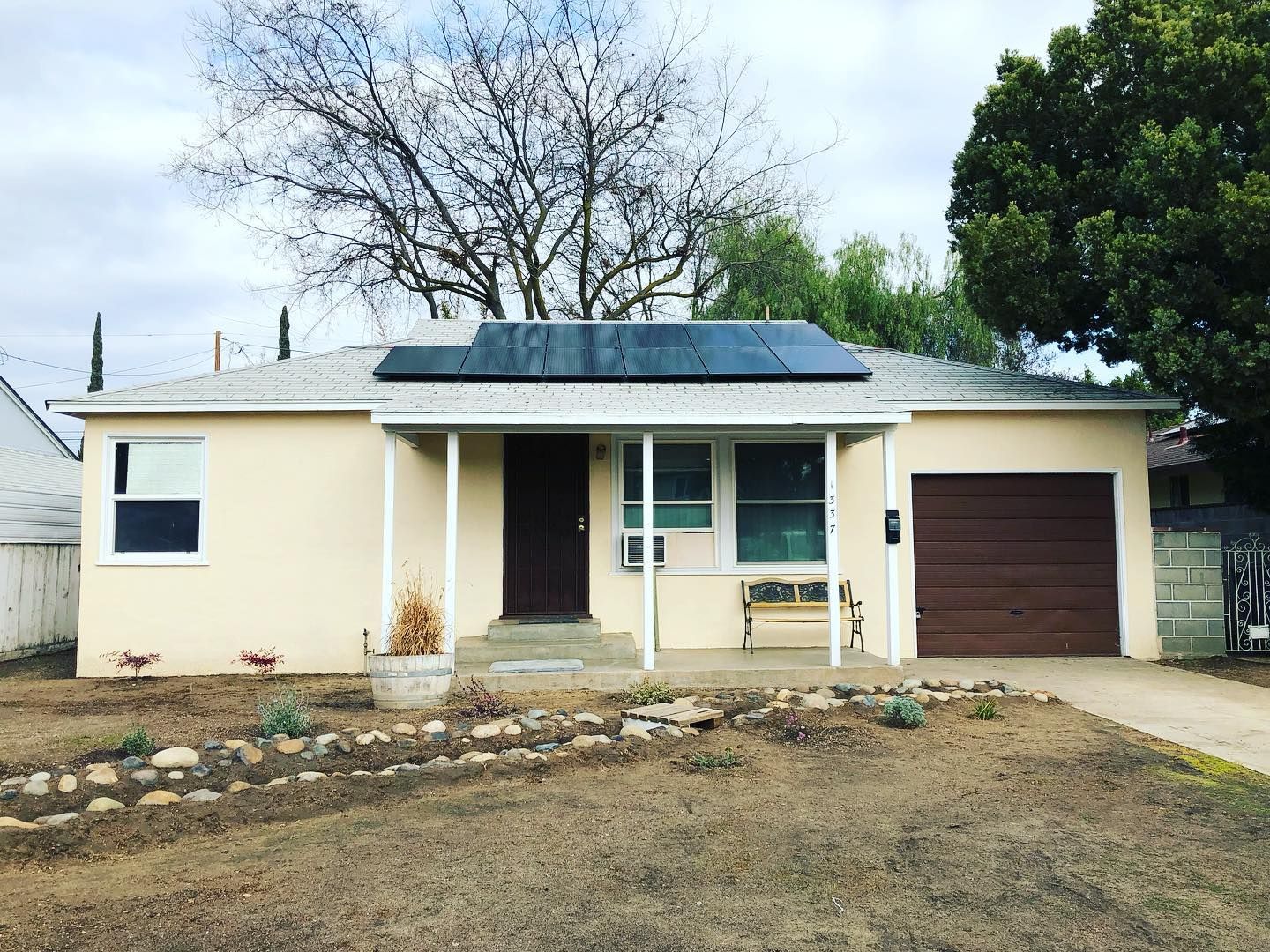 a house with a solar panel on the roof