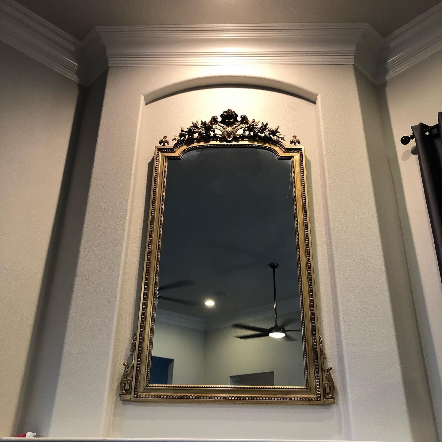 successful installation of big mirror on a wall