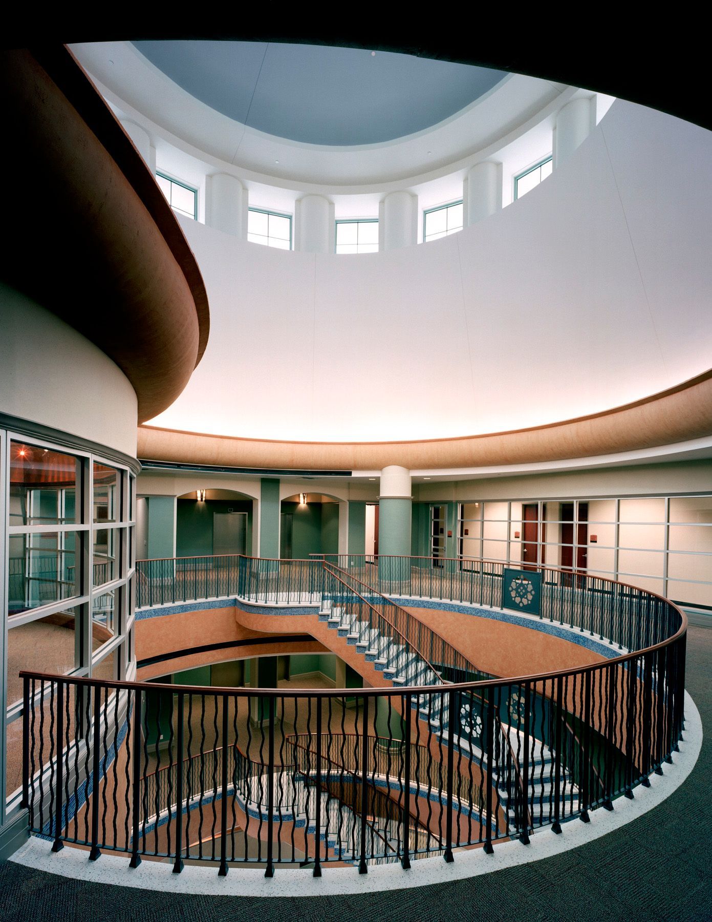 A circular staircase in a building with a dome ceiling