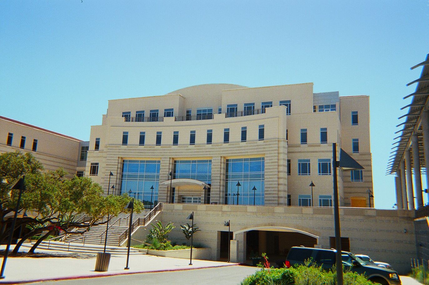 A large building with a blue sky in the background
