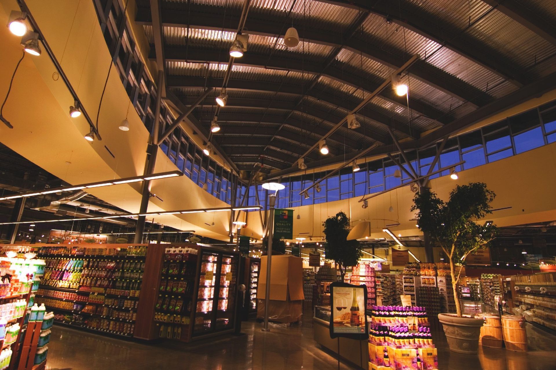 The inside of a grocery store with lots of shelves