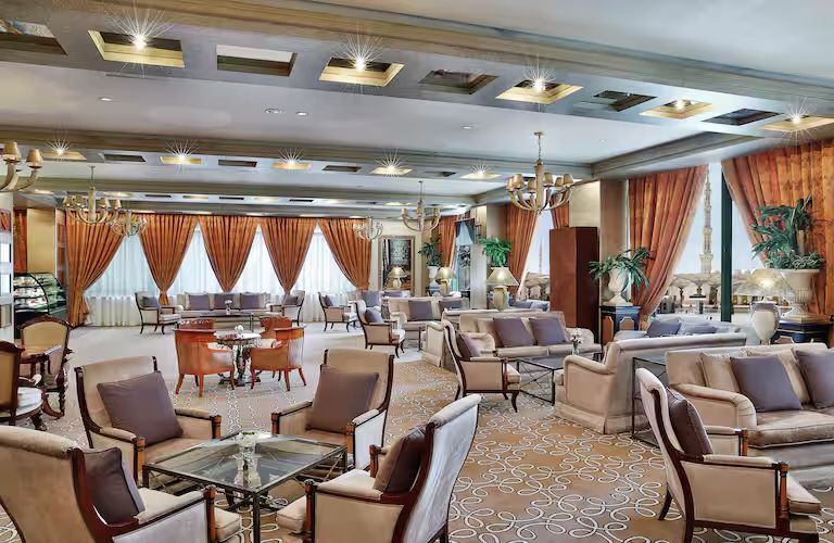 A large room filled with furniture and tables.
