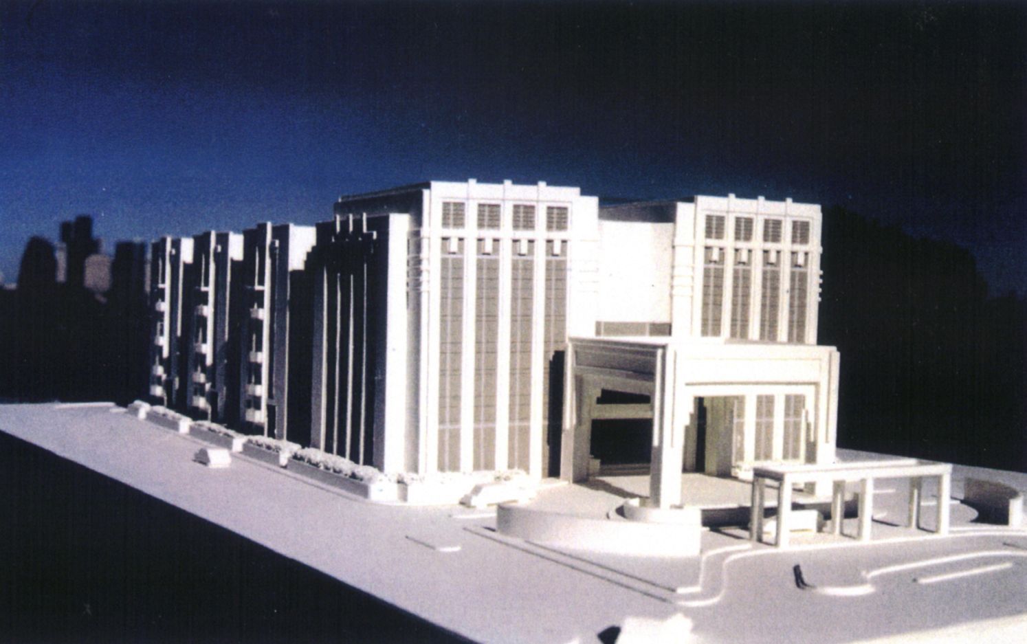A model of a building with a blue sky in the background