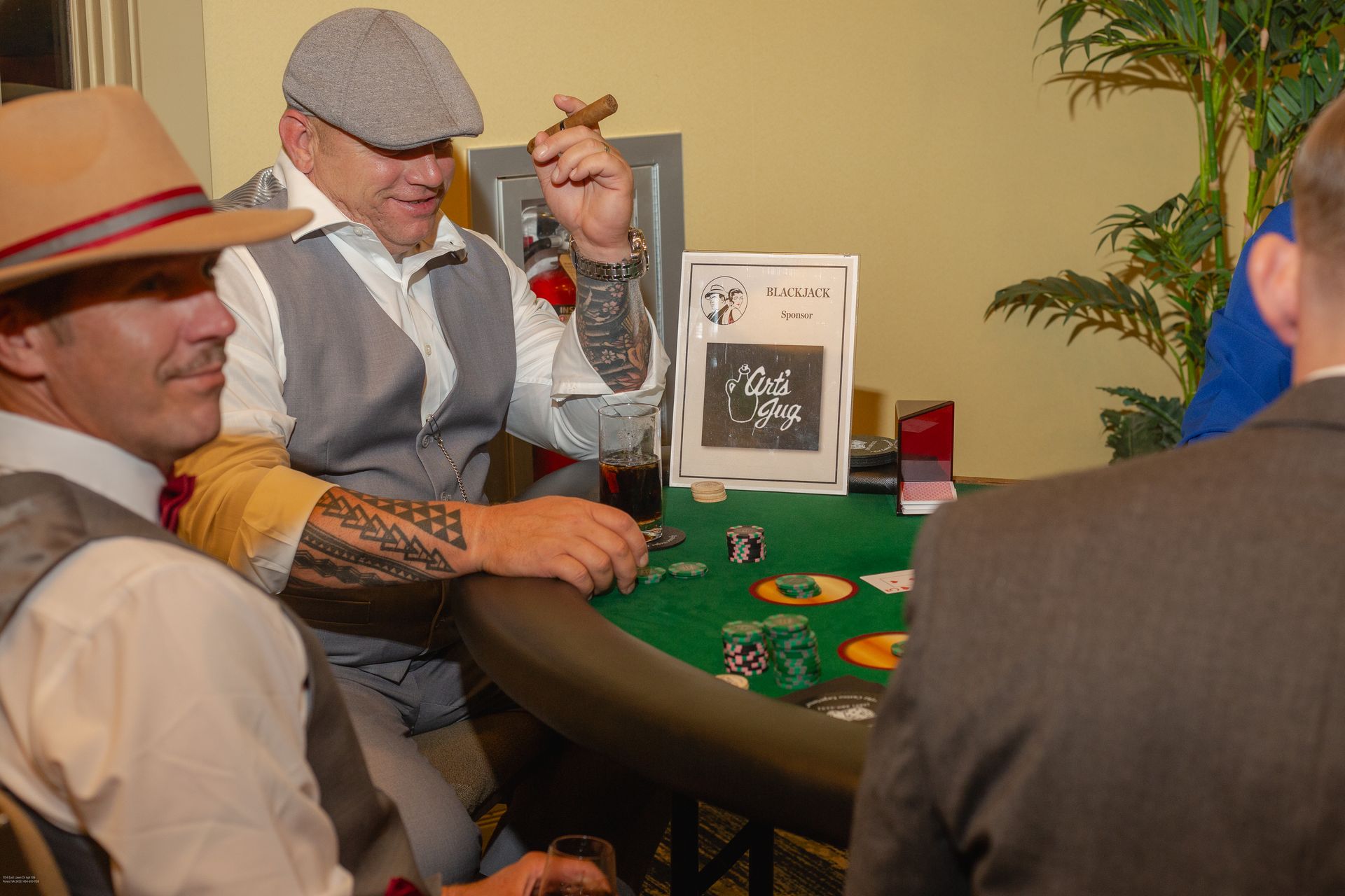 A group of men are sitting at a table playing poker.