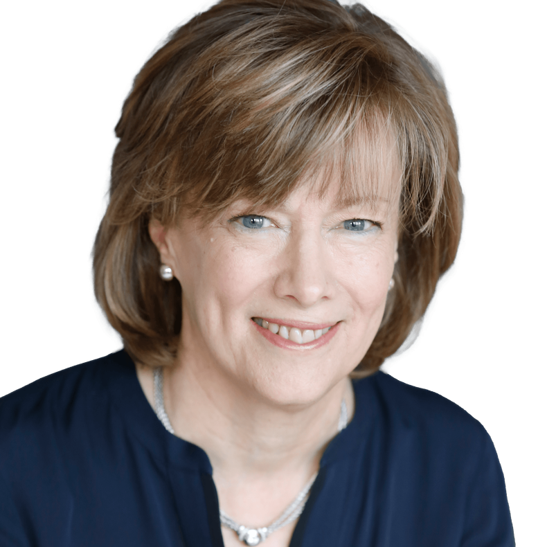 Woman with short brown hair, smiling, wearing a blue shirt and silver necklace, against a white background.