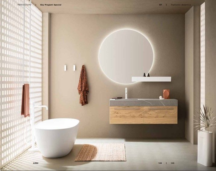 Un bagno con vasca, lavandino e specchio