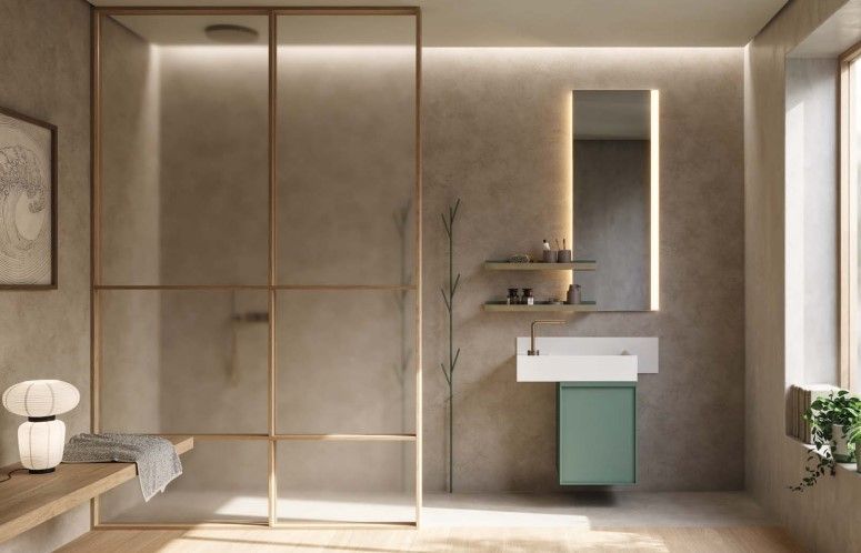 Un bagno con lavandino, specchio e cabina doccia.