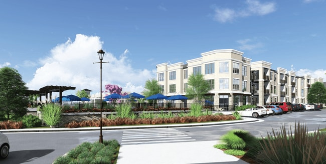An artist 's impression of a large apartment building with cars parked in front of it.