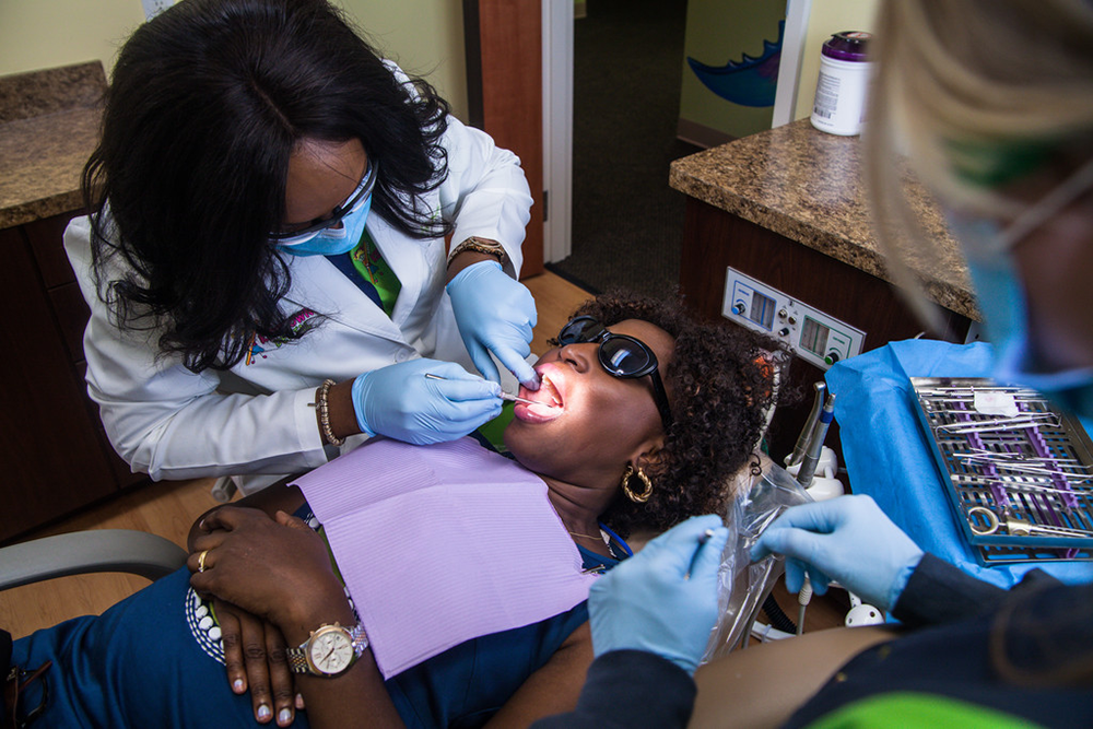 Doctor working on a patients teeth