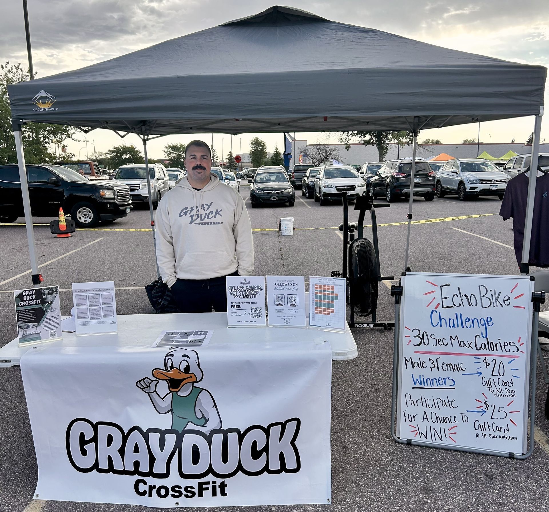 Coach Josh with the Gray Duck CrossFit tent and challenge