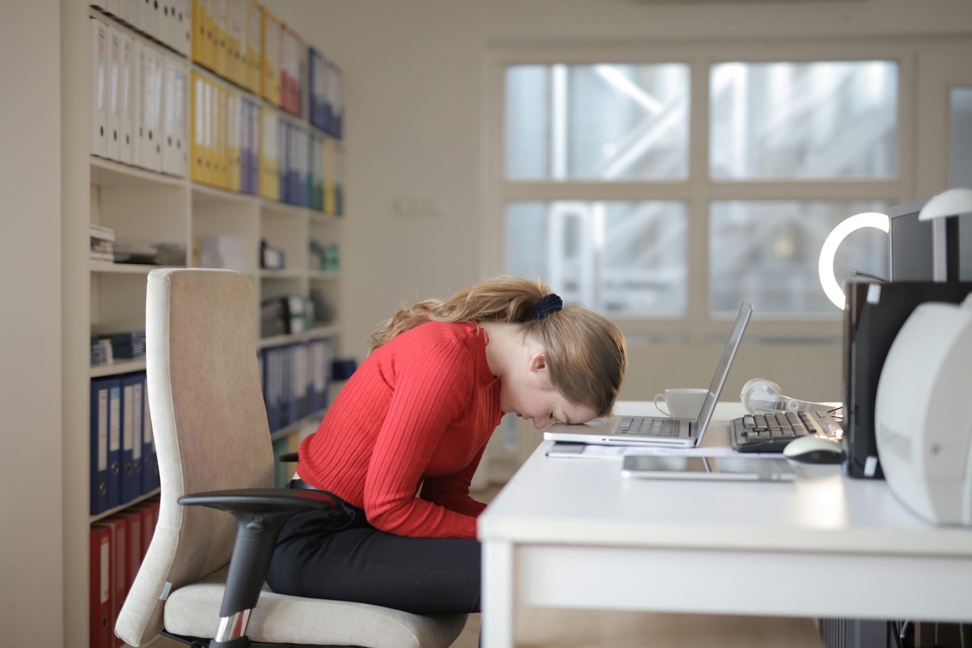 Woman stressed out at her desk