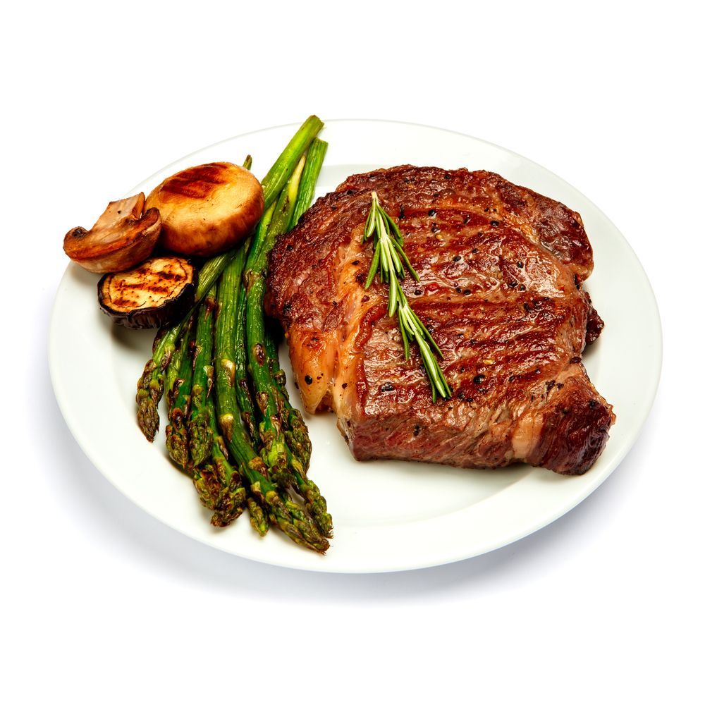 Grilled Steak With Asparagus and Roasted Potatoes on a White Plate — Romanas Italian Restaurant in Mermaid Beach, QLD